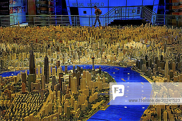 Model of Shanghai at a city planning museum near People’s Square in the Puxi side of Shanghai. A massive miniature city displays models that show not only existing buildings  but also those planned for the future; Shanghai  People's Republic of China