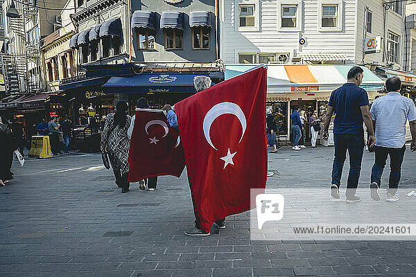 Man selling Turkish flags in Kadikoy  Istanbul; Istanbul  Turkey