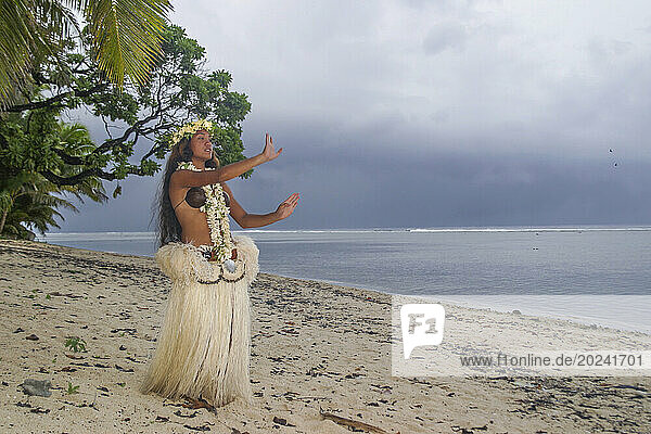 Female Polynesian dancer in the Cook Islands. The beauty of the Polynesian people radiates from this Rarotongan born dancer on the island of Rarotonga in the South Pacific; Cook Islands