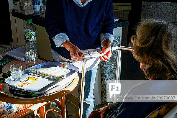 Liberal nurse visiting an elderly person. Medical follow-ups.