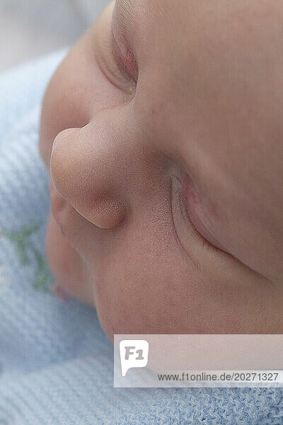 Close-ups of a newborn's face. Baby is 2 days old.