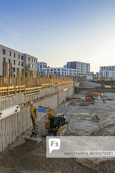 Construction site of new buildings with backhoes