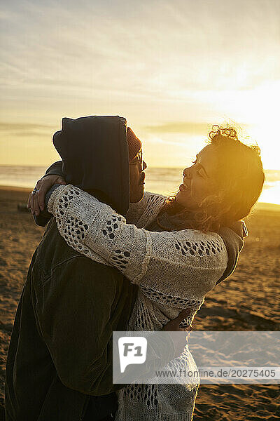 Loving young couple enjoying at beach