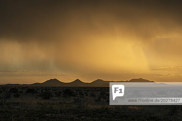Usa  New Mexico  Santa Fe  Storm and rain over Cerrillos Hills at sunset