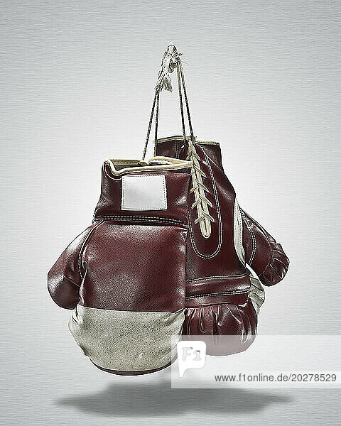 Studio shot of pair of old boxing gloves