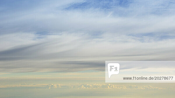 Layers of clouds from altitude 31 000 feet at sunrise