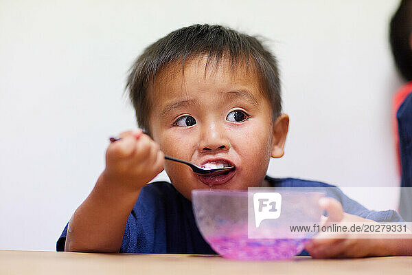 Kid eating shaved ice
