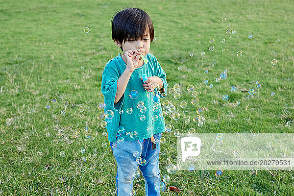 Kid playing in a field