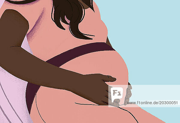 Close up pregnant woman holding stomach