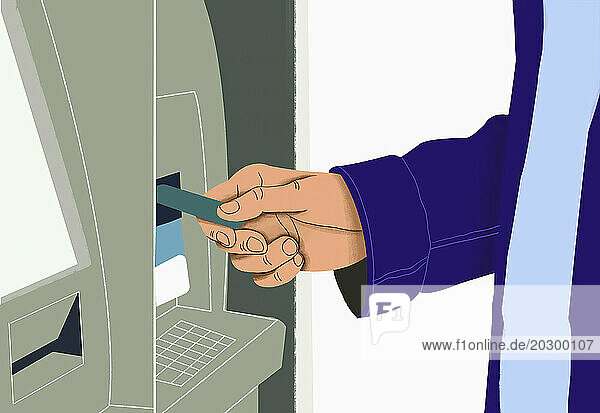 Close up man inserting debit card into ATM