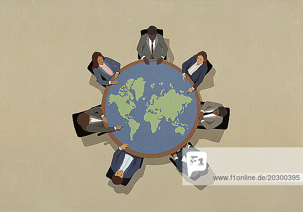 Business leaders meeting around round globe table
