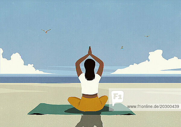 Serene woman meditating on yoga mat on sunny summer ocean beach