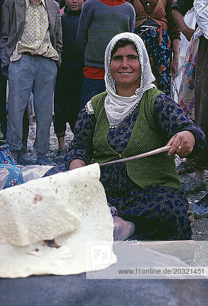 Turkey. South West region. Local woman making traditional flat bread.
