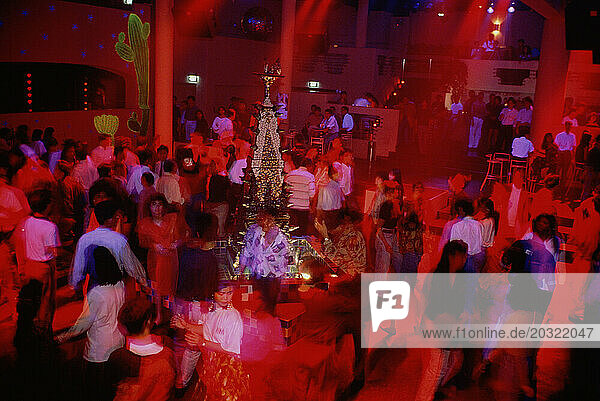 Singapore. Nightlife. Zouk nightclub. Clubbers on crowded dance floor.