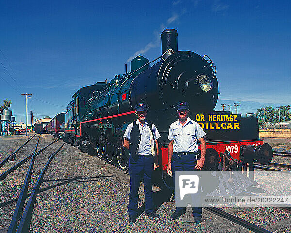 Australia. Queensland. Winton. Railways. Two men standing by B Class Heritage Engine.