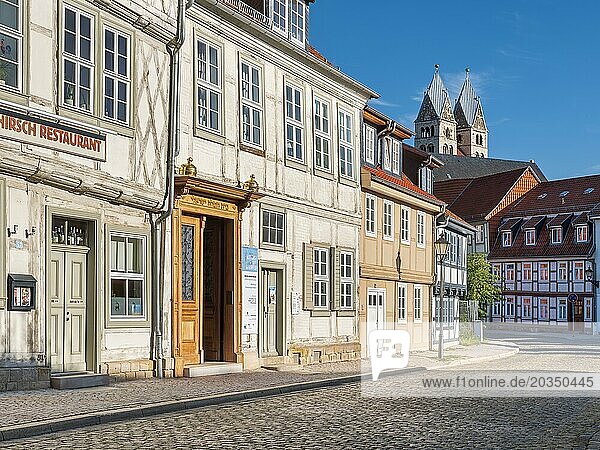 Street with half-timbered houses and cobblestones at the Jewish museum in the historic old town  in the background the towers of the Church of Our Dear Lady  Halberstadt  Saxony-Anhalt  Germany  Europe
