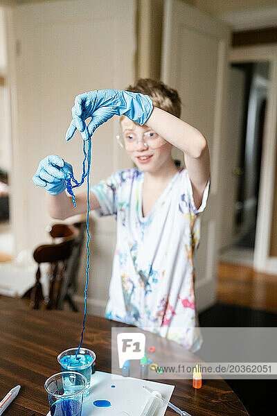 Boy Plays With Jelly Worms Made From Home Science Project