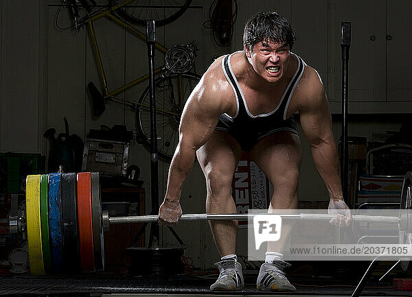 A weight lifter training.