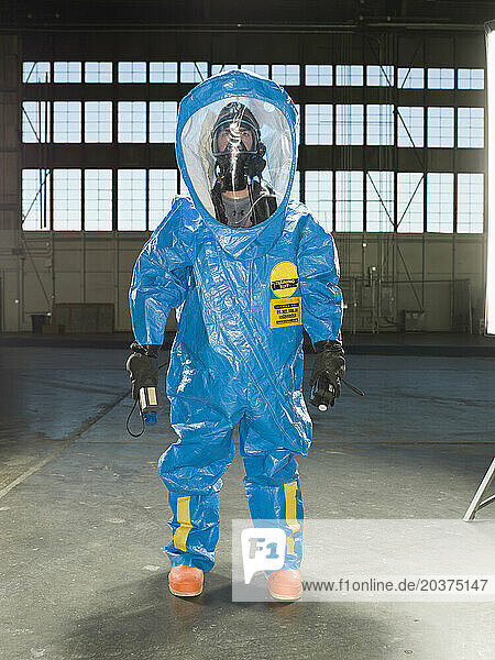 A National Guardsman wears a Nuclear radiation suit during training at an air base in South Dakota.