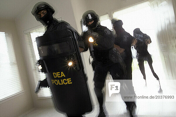Drug agents train in a practice facility.