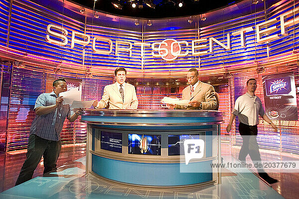 Four men work behind the backdrop inside the Sportscenter TV Studio of ESPN in Bristol  Connecticut.