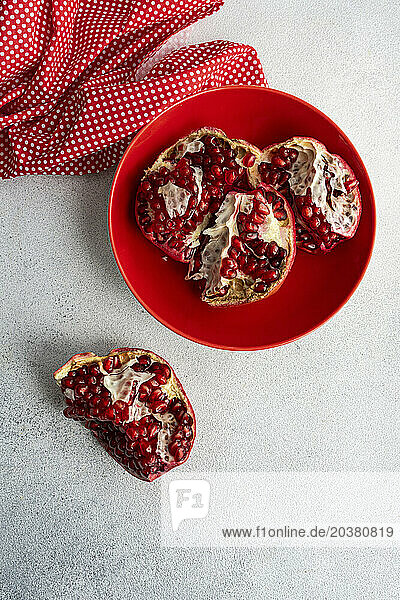 Pieces of pomegranate in a ceramic bowl