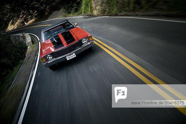 Red Muscle Car on a Mountain Road.