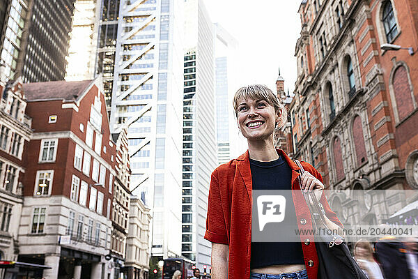 Happy young woman exploring city