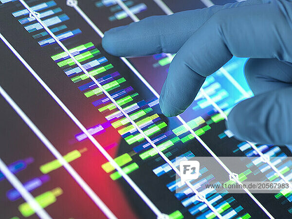 Senior scientist analyzing DNA profile on computer screen at lab