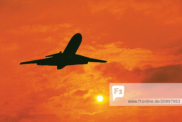 Jet aircraft. Sunset flight.