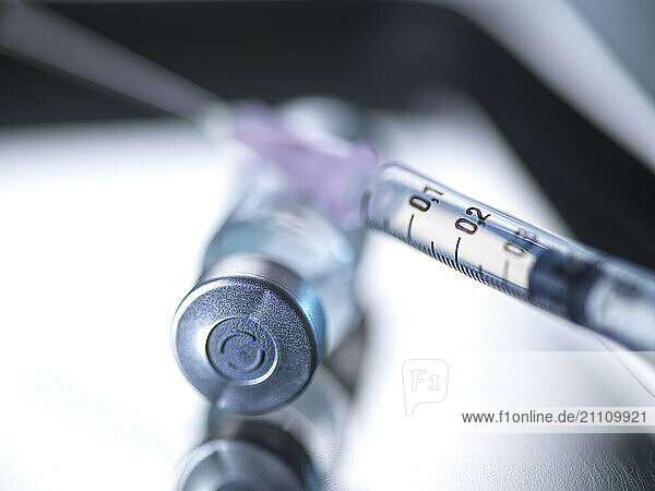 Vial and syringe kept on tray