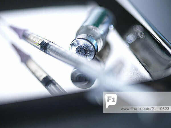 Vial with syringe kept on tray