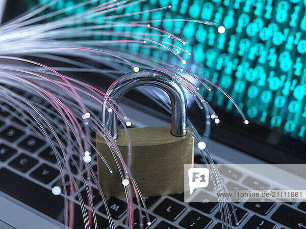 Padlock protecting laptop from vulnerability