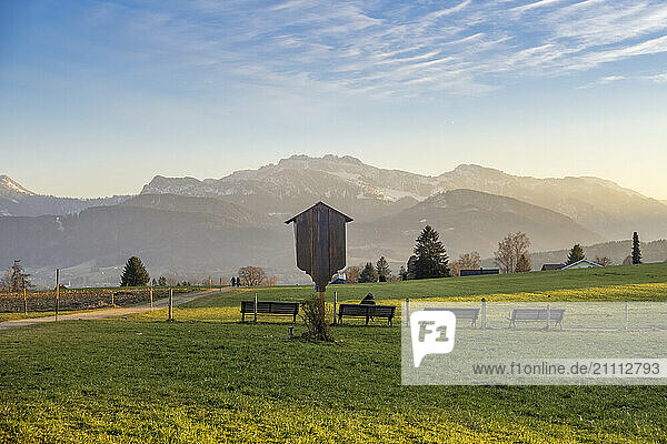 View of Alps and Kampenwand mountain from agricultural field