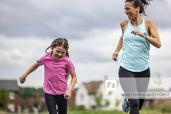 Happy daughter running with mother