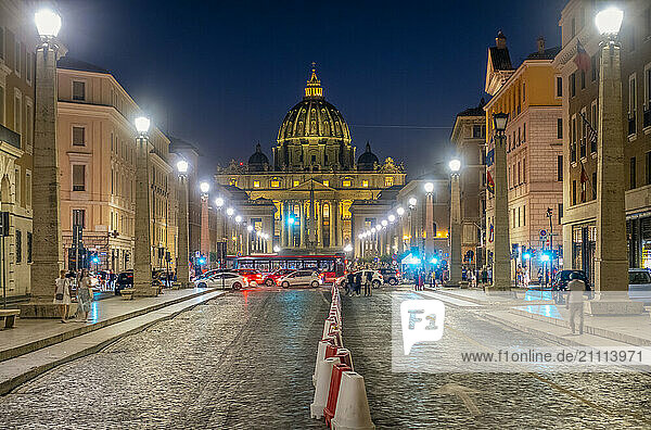 Basilica of St. Peter's with buildings in Vatican at night Rome  Italy