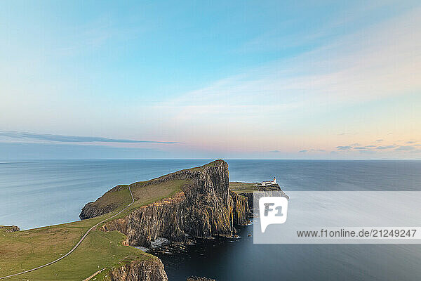 Scenic view of Neist Point lighthouse on the Isle of Skye  Scotland at sunset.