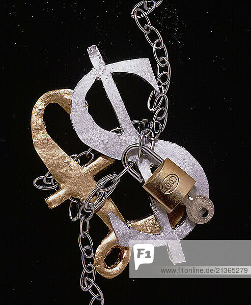 Concept still life. Currencies. GBP Â£ & USD $ symbols chained together.