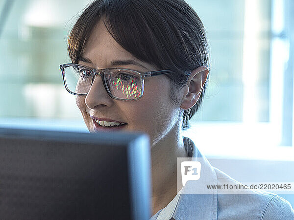 Financial analyst viewing stock market performance of a company share price.