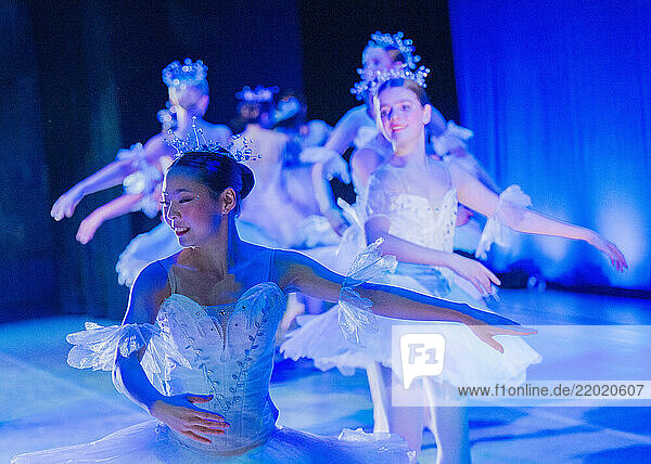 Ballet dancers perform gracefully on stage in elegant white costumes and sparkling tiaras  The Nutcracker  Bainbridge Island  USA