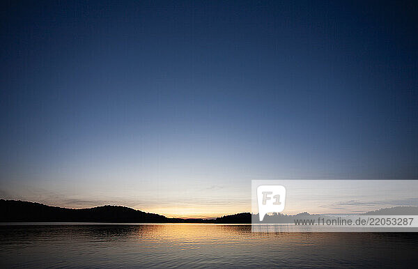 Sunset at calm Upper Saranac Lake