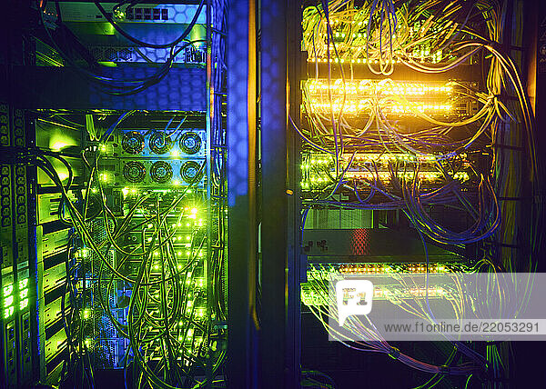 Close-up of hard drives and cables in data center