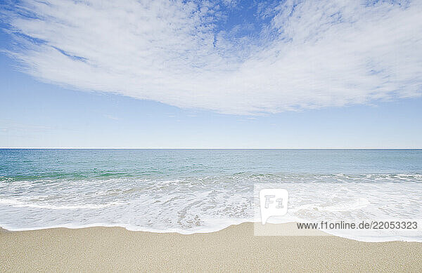 Ocean waves on sandy beach
