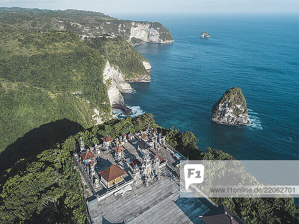 Aerial view of Balinese Hindu temple  Kelingking Beach area  Nusa Penida island  Bali  Indonesia