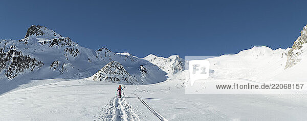Switzerland  Grand Saint Bernard Pass  Pain de Sucre  Mont Fourchon  woman ski touring in the mountains