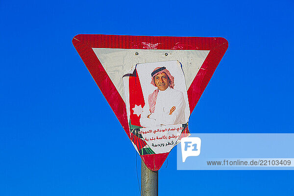 Middle East  Jordan  Aqaba  politician's poster on yield sign