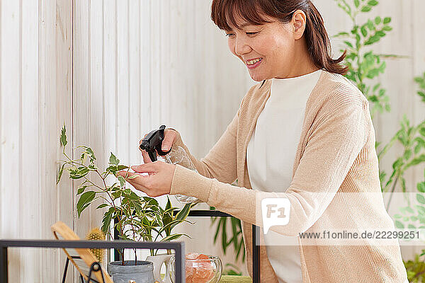 Japanese Woman Watering Plants
