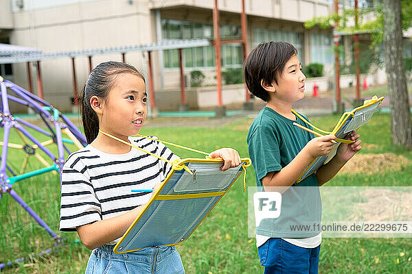Japanese Kids Studying Outside