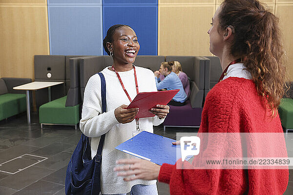 Smiling women talking in community center