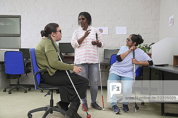 Visually impaired women in office